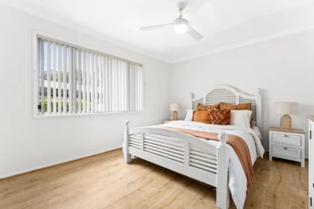 Bedroom with white bed